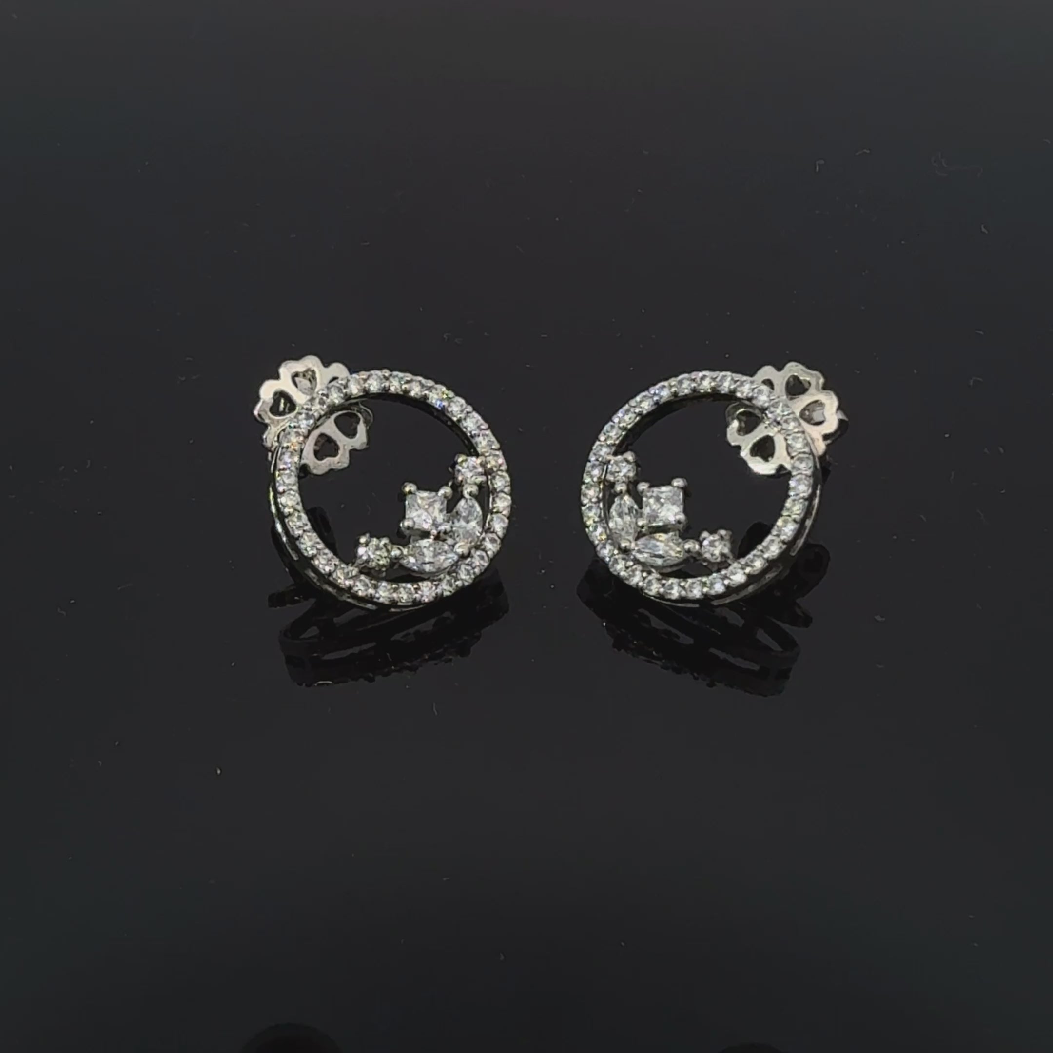 Silver heart shaped designer danglers earrings